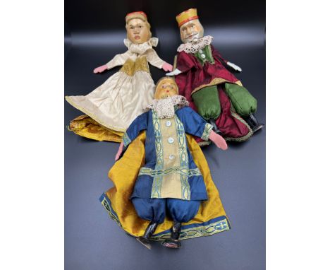 Three puppet style dolls with wooden heads and feet 