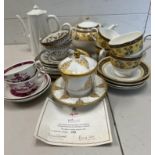 A mixed selection of china tea cups and teapots, various makers