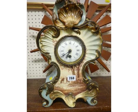 Elaborately decorated porcelain mantel clock