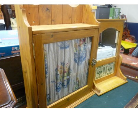 Pine hanging cupboard and a similar tiled back hall mirror with shelf