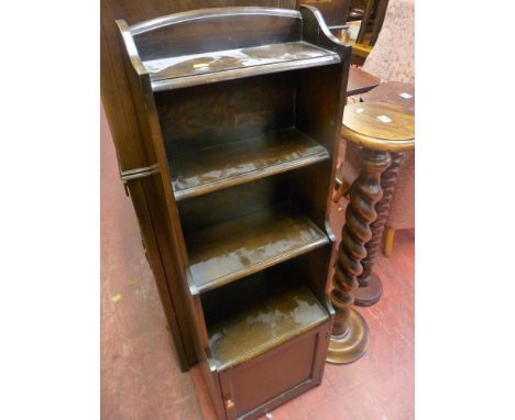 Four shelf slim bookcase with base cupboard