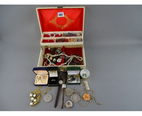 Vintage jewellery box and contents including a heavy silver ingot on chain, silver mounted American one dollar, costume jewel