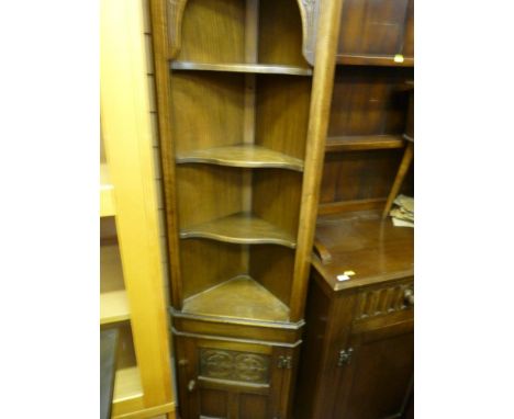 Compact corner unit with upper shelves and base cupboard