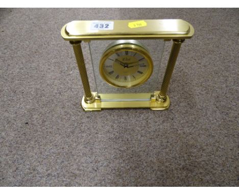 Heavy brass effect and glass mantel clock by 'The Clock Company' and a small parcel of sticks and riding crops