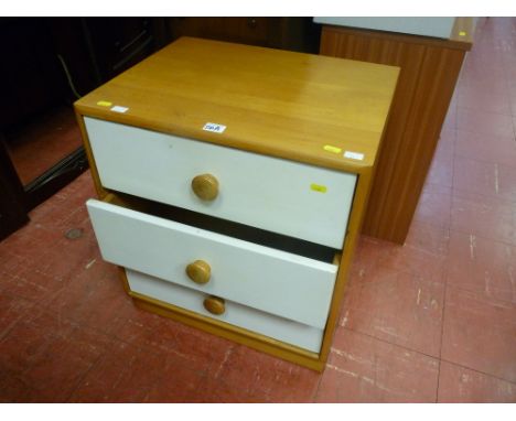 Modern light narrow chest of three painted white drawers