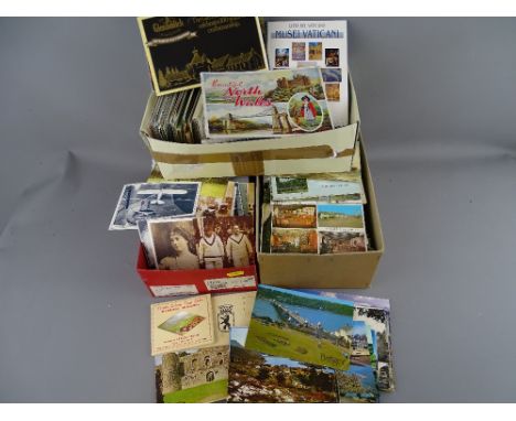Large quantity of vintage postcards and other ephemera contained within three boxes