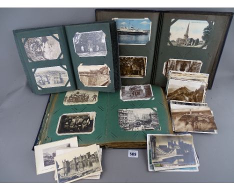 Collection of four hundred plus vintage postcards and photographs contained in three albums and loose including street scenes