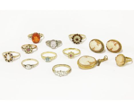 A collection of rings to include a Victorian ruby and split pearl ring, a gold single stone zircon ring, a gold opal cabochon