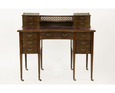 An Edwards & Roberts Chippendale revival writing table, having superstructure with arrangement of drawers above an inset leat