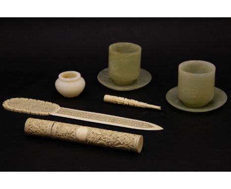 Two Chinese jade beakers, with bird detail, a small squat form vase, and a collection of early 20th century ivory items