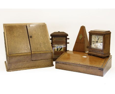 A stationery cabinet, desk calendar, clock, metronome, 6 inch globe, and a writing slope