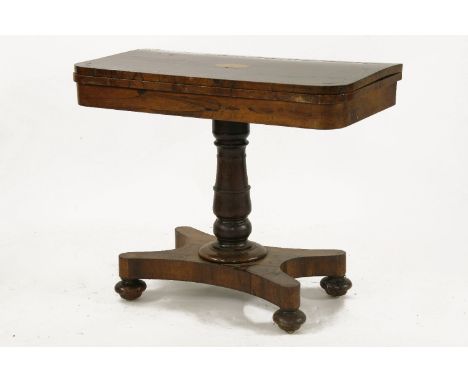 An early 19th century rosewood card table