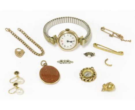 A 9ct gold mechanical watch with white enamel dial and later expanding bracelet,  a gold compass pendant, tested as 9ct gold,