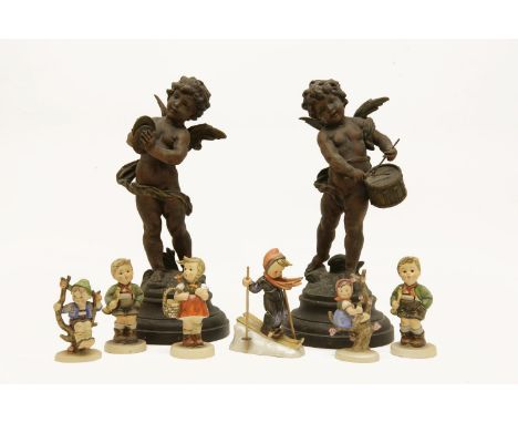 A collection of Hummel figures, and a pair of Spelter figures