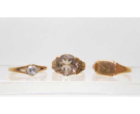 A 9ct gold retro smoky quartz ring, size R, a 9ct clear gem solitaire, size M1/2, a 9ct signet ring, size R, weight together 