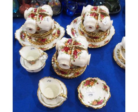 A Royal Albert Old Country Roses tea service comprising twelve cups, saucers, plates, two milk jugs and sugar bowls, two butt