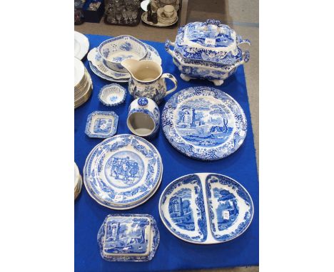 A collection of Spode Italian pattern tableswares including a soup tureen and ladle, sectioned veg dish, two large circular p