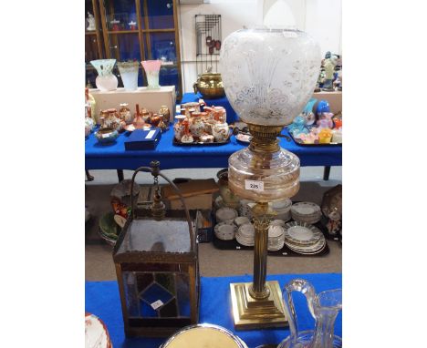 A leaded and stained glass hall light together with a brass column oil lamp with etched glass shade Condition Report:Availabl