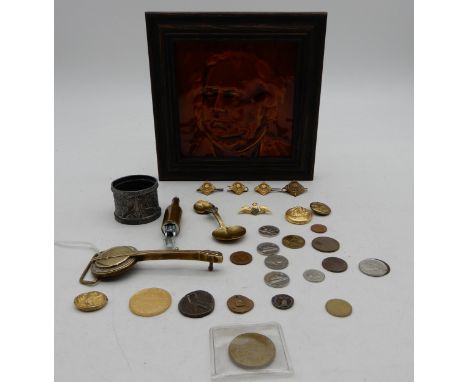 A framed glazed portrait tile depicting a 19th century gentleman, a small selection of mixed coinage, military rank pips etc.