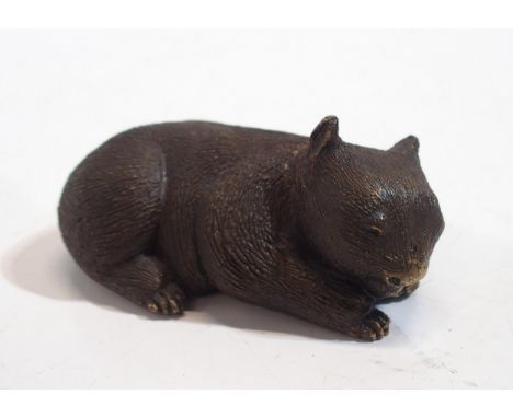 An Australian bronze model of a sleeping wombat, signed Mary Michelmore to base Condition Report:Available upon request