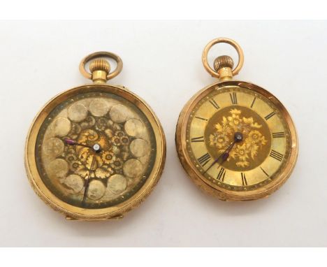 An 18ct open face fob watch with gold coloured decorative dial, diameter 3.9cm, weight 37.9gms with mechanism and inner metal