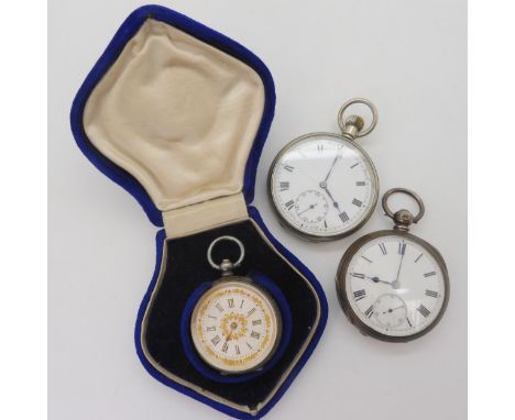 A continental silver fob watch with a silver &amp; gold coloured decorative dial, diameter 3.9cm, in original fitted box, tog