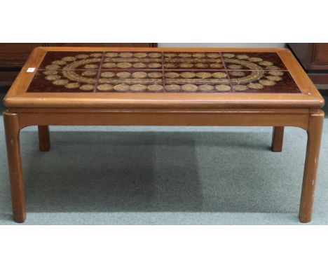 A mid 20th century teak framed Nathan tile topped coffee table, 41cm high x 93cm long x 51cm deep Condition Report:Available 