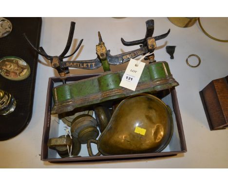 A vintage set of balance scales marked Bartlett, Bristol; and various bell weights.