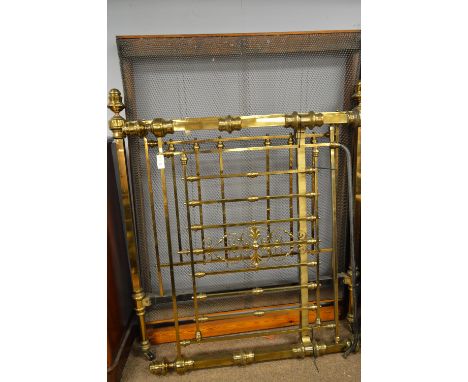 A 20th Century brass bed, with spar back, head and footboard, surmounted with finials, raised on ceramic castors, 162 x 144 x