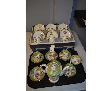A cased set of six Royal Worcester 'Wallflower' coffee cups and saucers; together with a Paragon 'Honiton' coffee set of six 