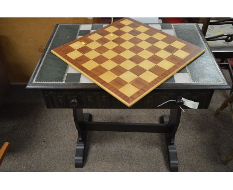 A Humbrol limited edition oak carved Tower of London chess table, the rectangular top with inset leather playing surface abov