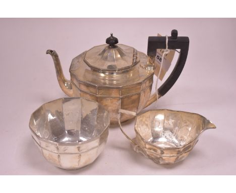 A silver three-piece tea service, by James Dixon &amp; Sons Ltd, Sheffield 1908, of polygon form with reeded bands, 18.7oz gr