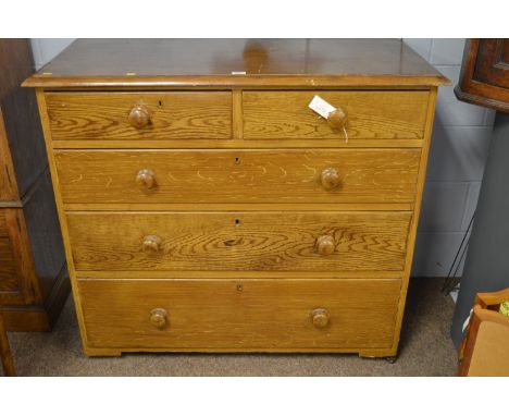 A Victorian and later simulated pine chest, the moulded top above two short over three long drawers, raised on ceramic castor