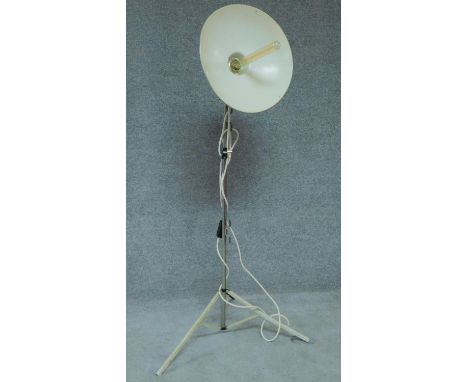 A vintage metal spotlight on adjustable tripod stand with makers label Paterson. H.145cm 