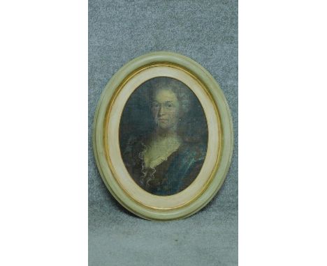 A 19th century oil on canvas laid on board, oval framed portrait. 59x48cm 