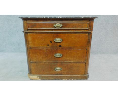 A 19th century Continental walnut commode with grey marble top, fitted four long drawers. H.74 W.80 D.52cm (repair to marble)