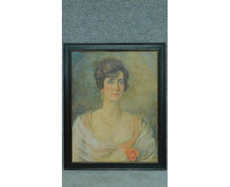 A framed oil on canvas, female portrait, signed Eleanor S Wood. 75x60cm 