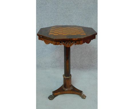 A Regency rosewood octagonal topped chessboard inlaid occasional table on tripod platform base and carved lion's paw feet. H.