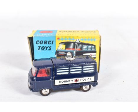 A BOXED CORGI TOYS COMMER POLICE VAN WITH FLASHING LIGHT NO.464, painted dark blue with county police sticker to each side, l