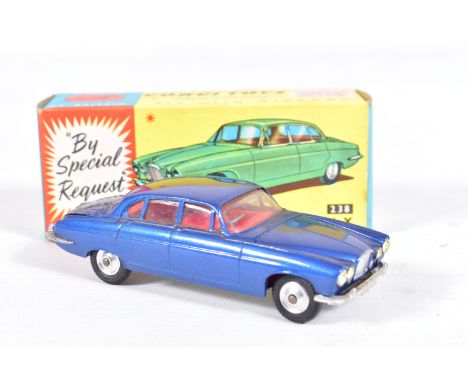 A BOXED CORGI TOYS JAGUAR MARK X, No.238, metallic deep blue body with red interior and complete with both suitcases, in very