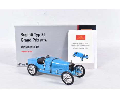 A BOXED CMC 1/18 SCALE 1924 BUGATTI TYPE 35 GRAND PRIX CAR, No.M-063, complete and in very good condition, but leather strap 
