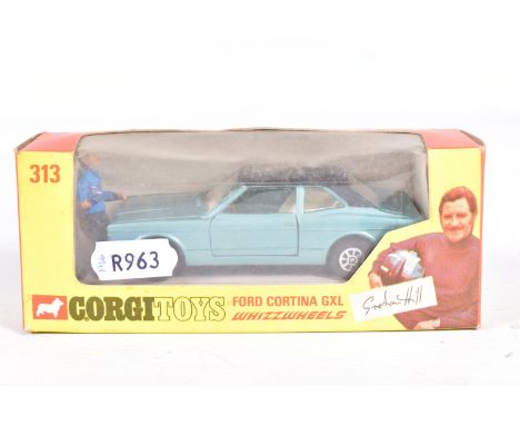 A BOXED CORGI TOYS FORD CORTINA GXL, No.313, Whizzwheels, metallic blue body with black body, complete with Graham Hill figur