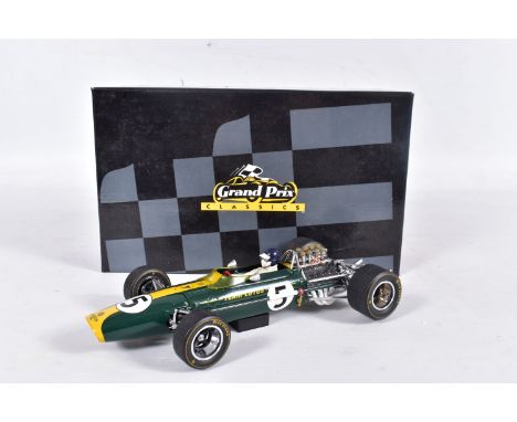 A BOXED EXOTO 1/18 SCALE GRAND PRIX CLASSICS LOTUS FORD TYPE 49, green with RN5, appears complete and in very good condition,
