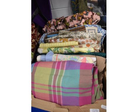 A box full of vintage and retro fabrics, a tweed skirt length and similar.