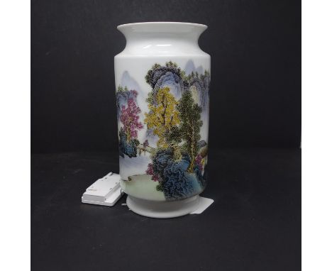 A Chinese famille rose vase, decorated with a continuous lakescape with mountains to background, bearing inscription and red 