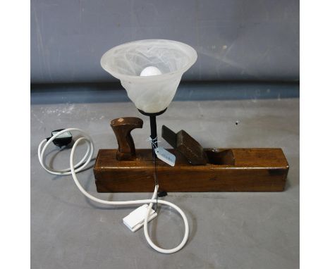 A table lamp made from woodworking plane, with frosted glass shade, H.31 W.43cm 