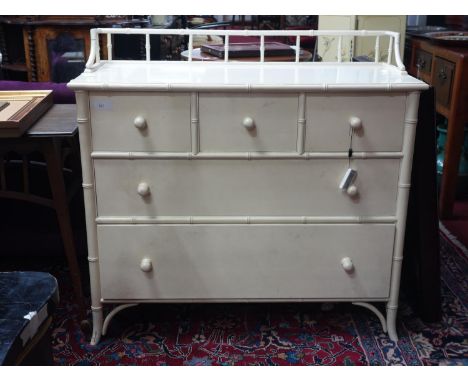 A cream lacquered chest of three short over two drawers, of bamboo design, H.96 W.102 D.44cm 