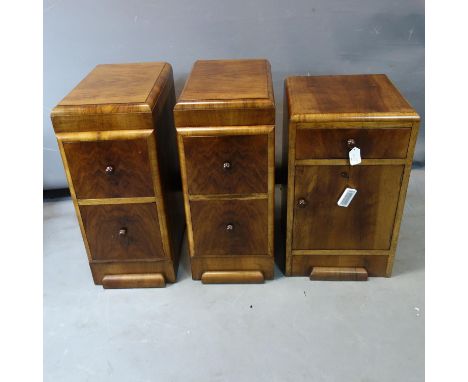 A pair of Art Deco walnut pedestal chests of 2 drawers, H.70 W.30 D.48cm, together with a walnut cupboard, having single draw