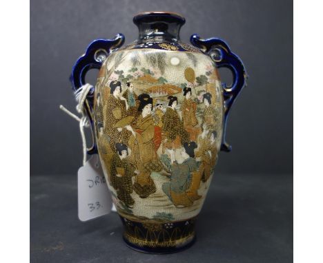 A Japanese twin handle satsuma vase, decorated with vignettes of geishas and warriors, stamped to base, H.18cm 