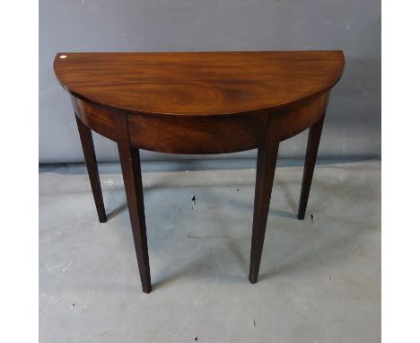 A mahogany demi-lune console table, raised on tapering legs, H.73 W.91 D43cm 